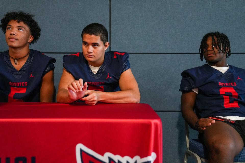 From left, Centennial seniors Jack Bal (defensive back), Braxton Manusina (Middle Linebacker), and Kavaughn Clark (running back) give an interview during a media day for Peoria Unified School District football teams at Rio Vista Community Center on Friday, August 26, 2022, in Peoria.