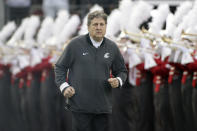 FILE - In this Nov. 16, 2019, file photo, Washington State head coach Mike Leach runs onto the field before an NCAA college football game against Stanford, in Pullman, Wash. Two people with knowledge of the decision says Mississippi State has hired Washington State's Mike Leach as its new head coach. The people spoke to The Associated Press on condition of anonymity Thursday, Jan. 9, 2020, because the school has not yet officially announced the move. Leach will replace Joe Moorhead, who was fired last week after two seasons. (AP Photo/Young Kwak, File)