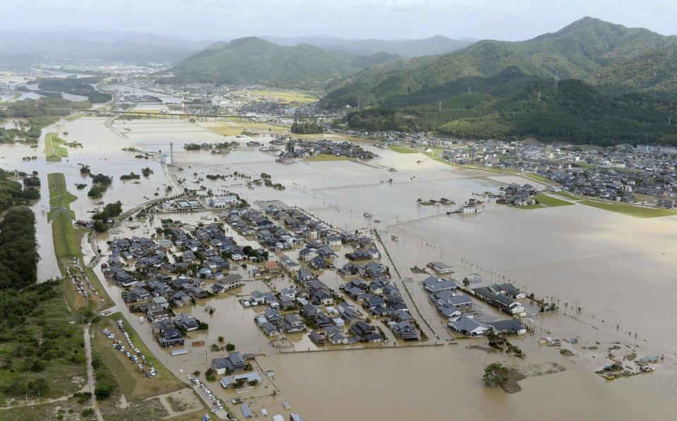 An aerial view shows flooded residential areas along the Katsura river as the river overflooded caused by tropical storm Man-yi, also called locally Typhoon No.18, in Kyoto