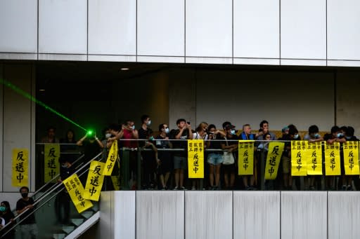 Placards reading "anti-China extradition" hang outside a shopping mall in Hong Kong's Tai Po district during a general strike