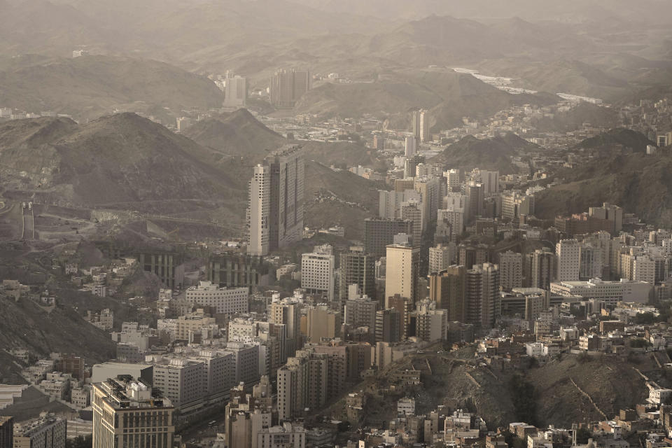 General view shows the mountains surrounding the Grand Mosque, during the annual hajj pilgrimage, in Mecca, Saudi Arabia, Thursday, June 22, 2023. Saudi Arabia has ambitious plans to welcome millions more pilgrims to Islam's holiest sites. But as climate change heats up an already scorching region, the annual Hajj pilgrimage could prove even more daunting. (AP Photo/Amr Nabil)