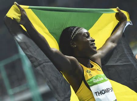 2016 Rio Olympics - Athletics - Final - Women's 100m Final - Olympic Stadium - Rio de Janeiro, Brazil - 13/08/2016. Elaine Thompson (JAM) of Jamaica celebrates. REUTERS/Dylan Martinez