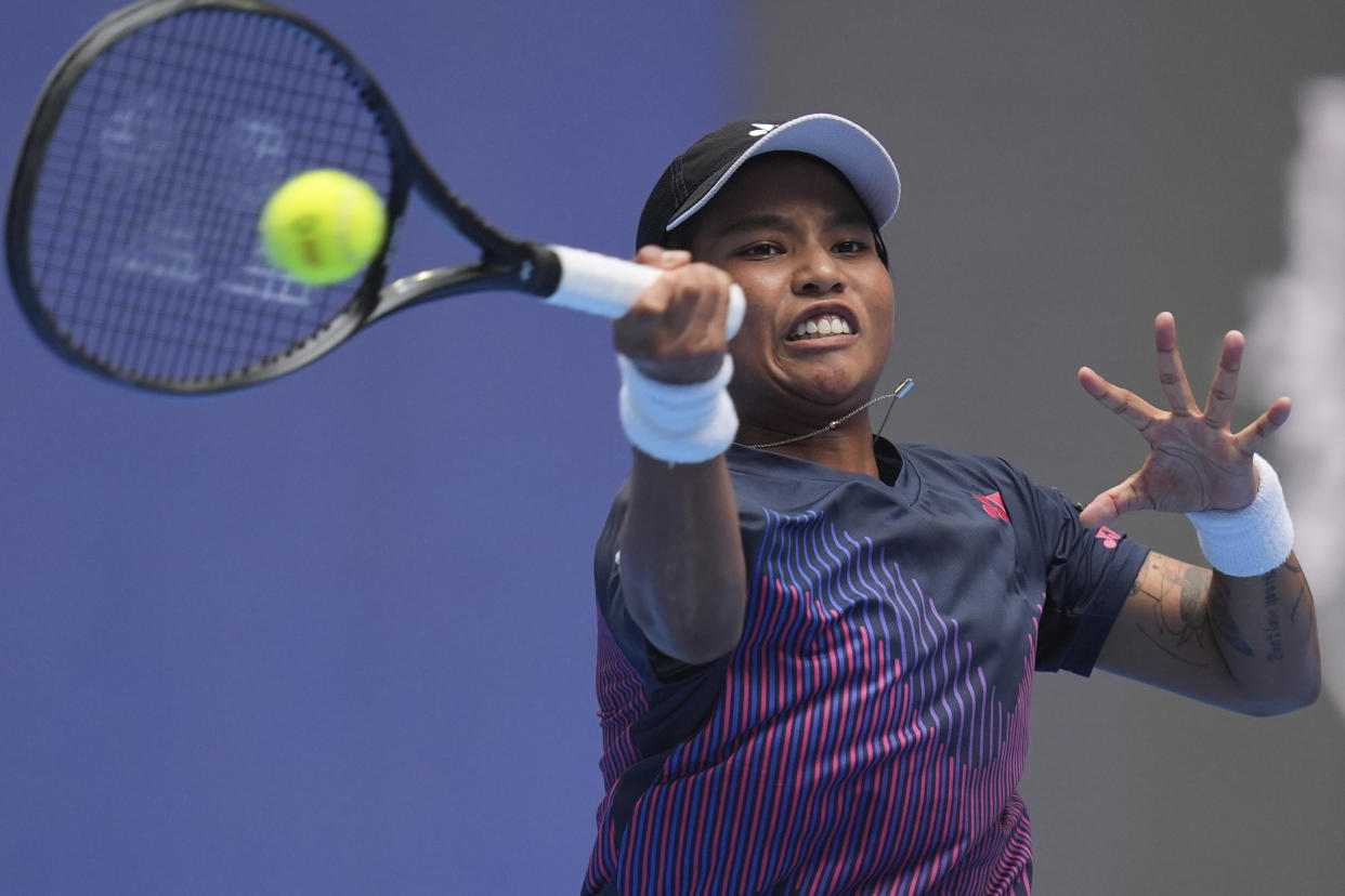 Mananchaya Sawangkaew of Thailand returns a shot to Aryna Sabalenka of Belarus during the China Open tennis tournament held at the National Tennis Center in Beijing, Saturday, Sept. 28, 2024. (AP Photo/Ng Han Guan)