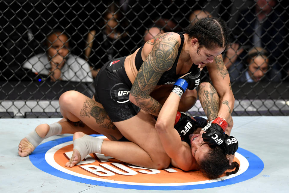 LAS VEGAS, NEVADA - DECEMBER 14:  Amanda Nunes of Brazil (top) strikes Germaine de Randamie of Netherlands in their UFC women's bantamweight championship bout during the UFC 245 event at T-Mobile Arena on December 14, 2019 in Las Vegas, Nevada. (Photo by Jeff Bottari/Zuffa LLC)