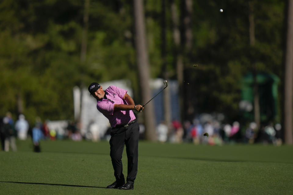 Patrick Reed chips to the green on the 13th hole during the final round of the Masters golf tournament at Augusta National Golf Club on Sunday, April 9, 2023, in Augusta, Ga. (AP Photo/Jae C. Hong)