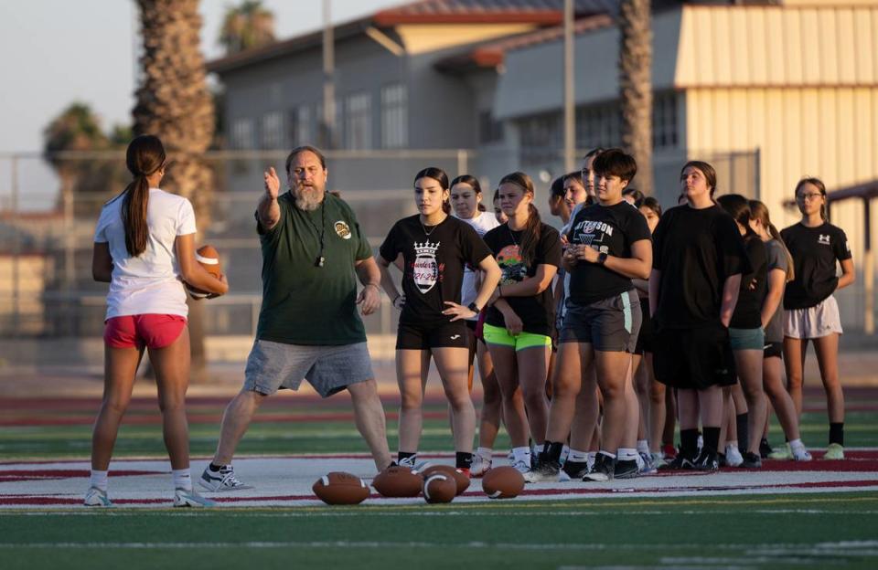 Patterson’s new flag football team coach Cade Tomasegovich gives direction during practice at Patterson High School in Patterson, Calif., Tuesday, August 1, 2023.