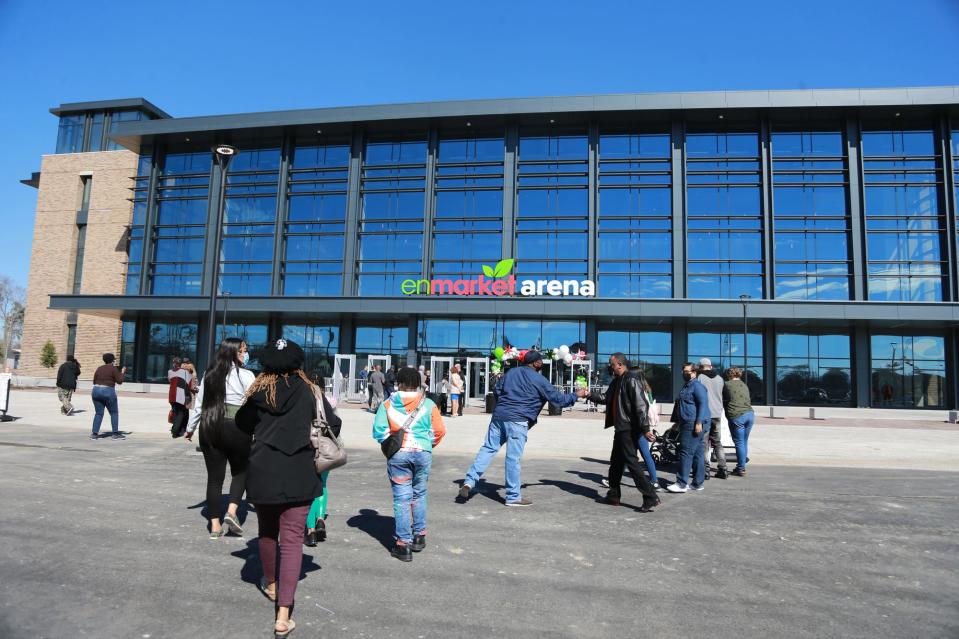 Visitors arrive at Enmarket Arena for a community event.