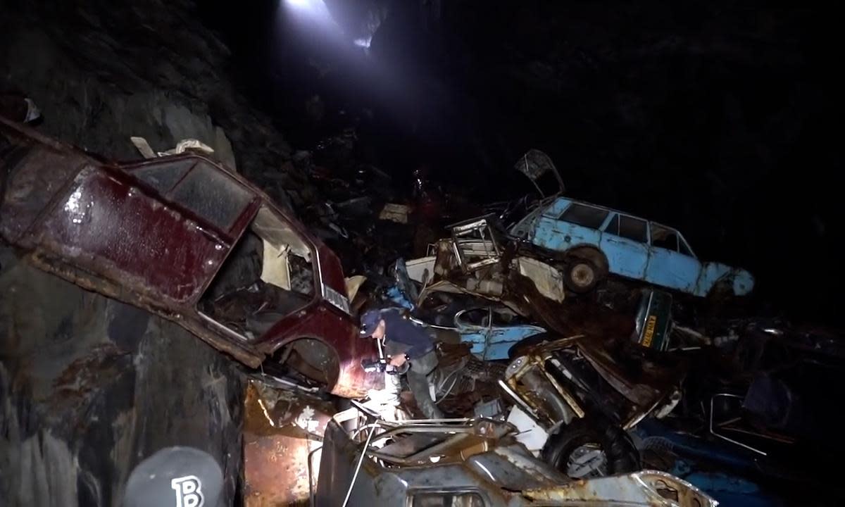 <span>Dumped cars in the disused Welsh mine.</span><span>Photograph: YouTube | Exploring With Josh</span>