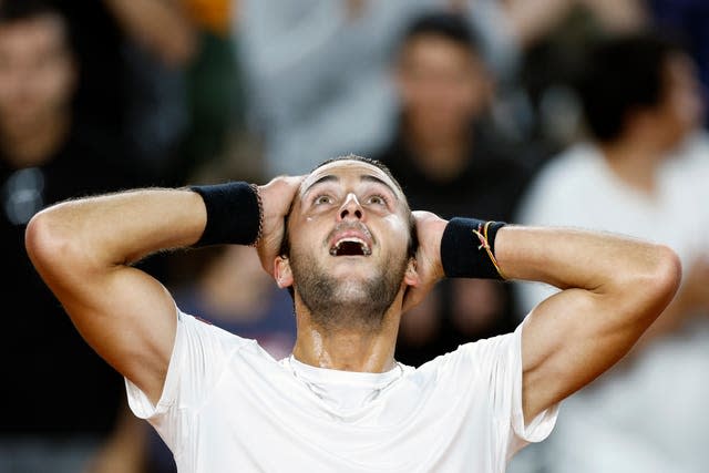 Argentina’s Tomas Etcheverry celebrates reaching a grand slam quarter-final for the first time 