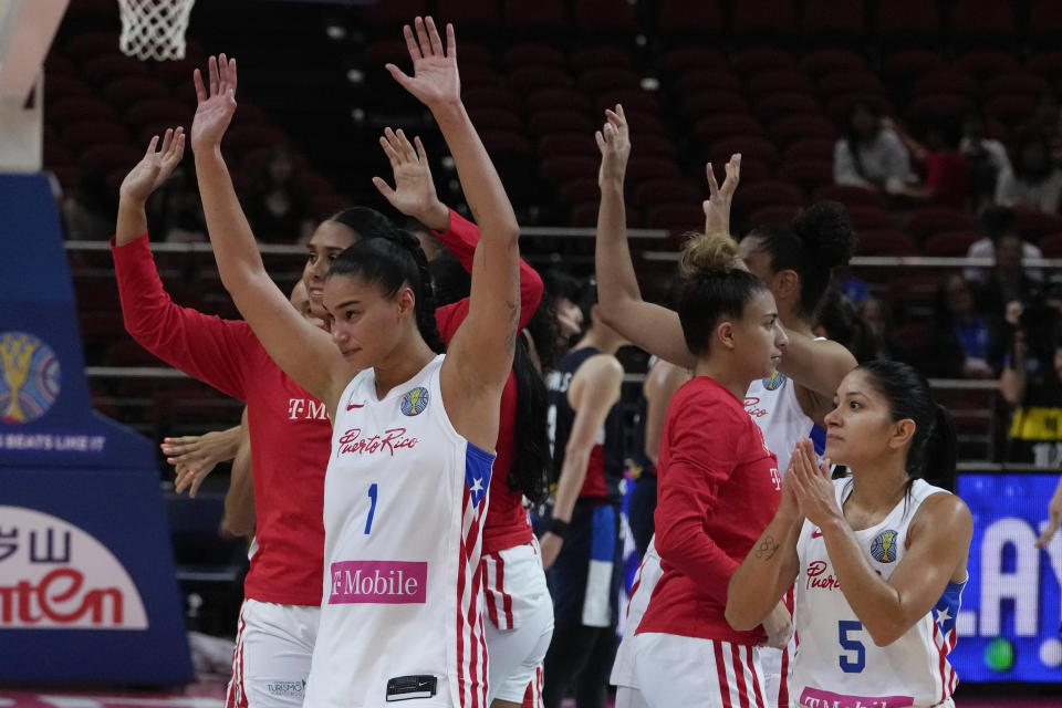 Puerto Rico players celebrate after defeating South Korea in their game at the women's Basketball World Cup in Sydney, Australia, Tuesday, Sept. 27, 2022. (AP Photo/Mark Baker)