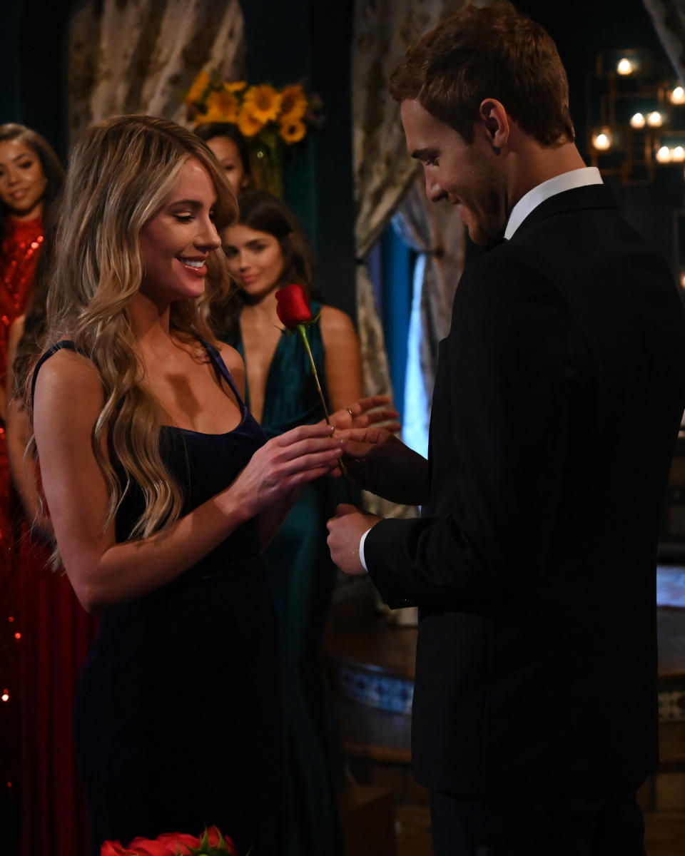 Peter Weber presents Victoria P. with a rose on the first night. (Photo: ABC/John Fleenor)