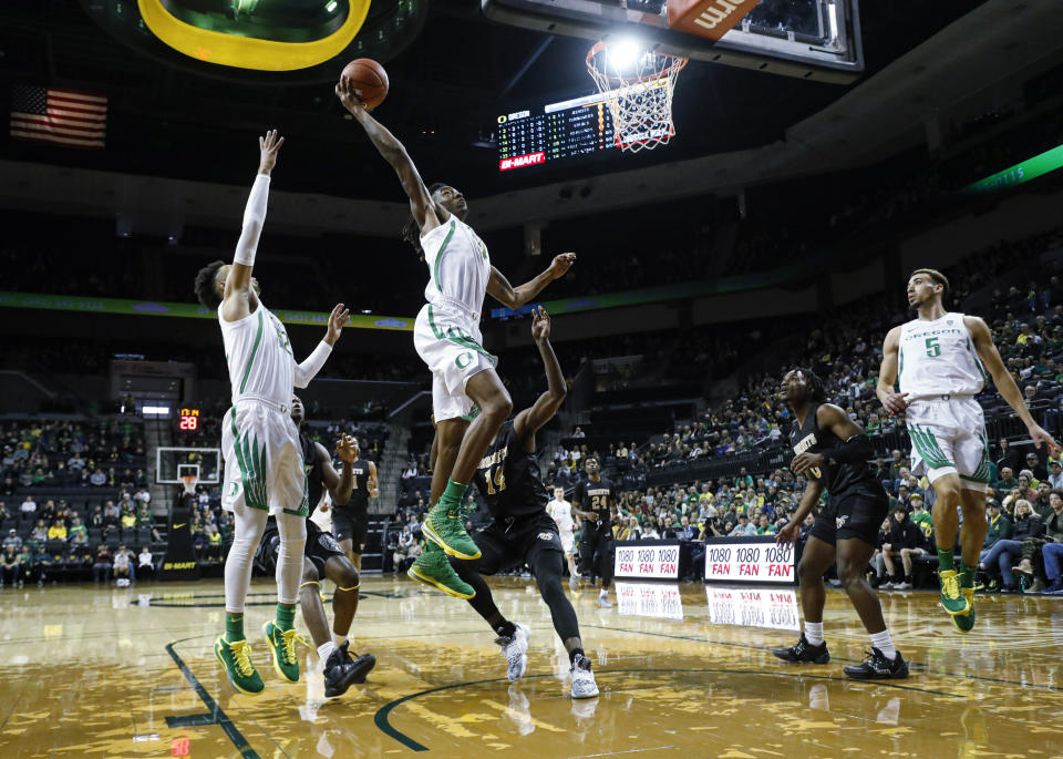 Oregon forward C.J. Walker (14), dunks against Alabama State during the first half of an NCAA college basketball game Sunday, Dec. 29, 2019, in Eugene, Ore. (AP Photo/Thomas Boyd)