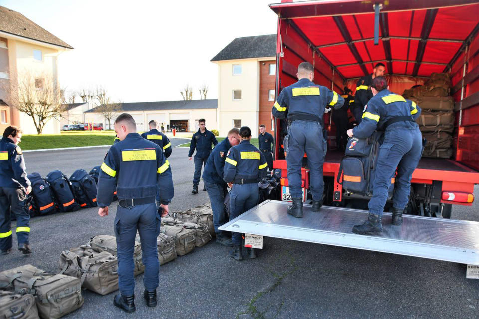 This photo provided Tuesday Feb.7, 2023 by the French Interior Ministry shows rescue workers loading a truck before heading to the Charles de Gaulle airport, north of Paris, Monday, Feb.6, 2023 in Nogent-le-Rotrou, central France. Countries around the world dispatched teams to assist in the rescue efforts, and Turkey's disaster management agency said more than 24,400 emergency personnel were now on the ground. But with such a wide swath of territory hit by Monday's earthquake and nearly 6,000 buildings confirmed to have collapsed in Turkey alone, their efforts were spread thin. (Ministere de l'Interieur via AP)