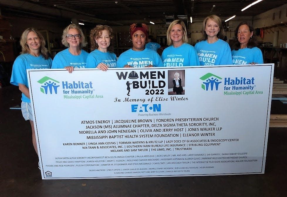 Celebrating Saturday’s kickoff of Habitat’s Women Build 2022 project are, from left, Susan Carson, Virgi Lindsay, Karen Mori Bonner, homeowner Brittany McIntyre, Mississippi First Lady Elee Reeves, Monica Day and Betty Smithson.