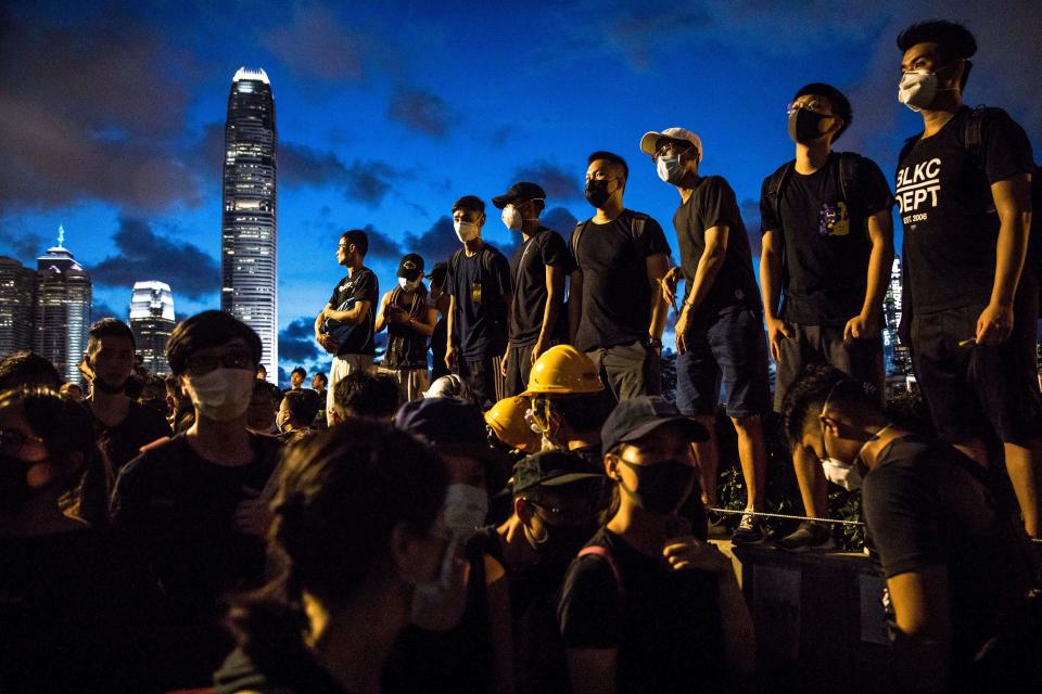 TOPSHOT - Protesters gather outside the government headquarters in Hong Kong on July1, 2019. - Hundreds of protesters stormed Hong Kong's parliament late on July 1 as the territory marked its China handover anniversary, ransacking the building and daubing its walls with graffiti as the city plunged into unprecedented depths of political chaos. (Photo by DALE DE LA REY / AFP)        (Photo credit should read DALE DE LA REY/AFP/Getty Images)