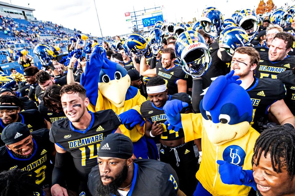 The Delaware Blue Hens, YoUDee and Baby Blue stand in front of the fans in celebration of the teams' 49-17 victory against NCAA newcomer the Monmouth Hawks at Delaware Stadium, Saturday, Nov. 5, 2022. 