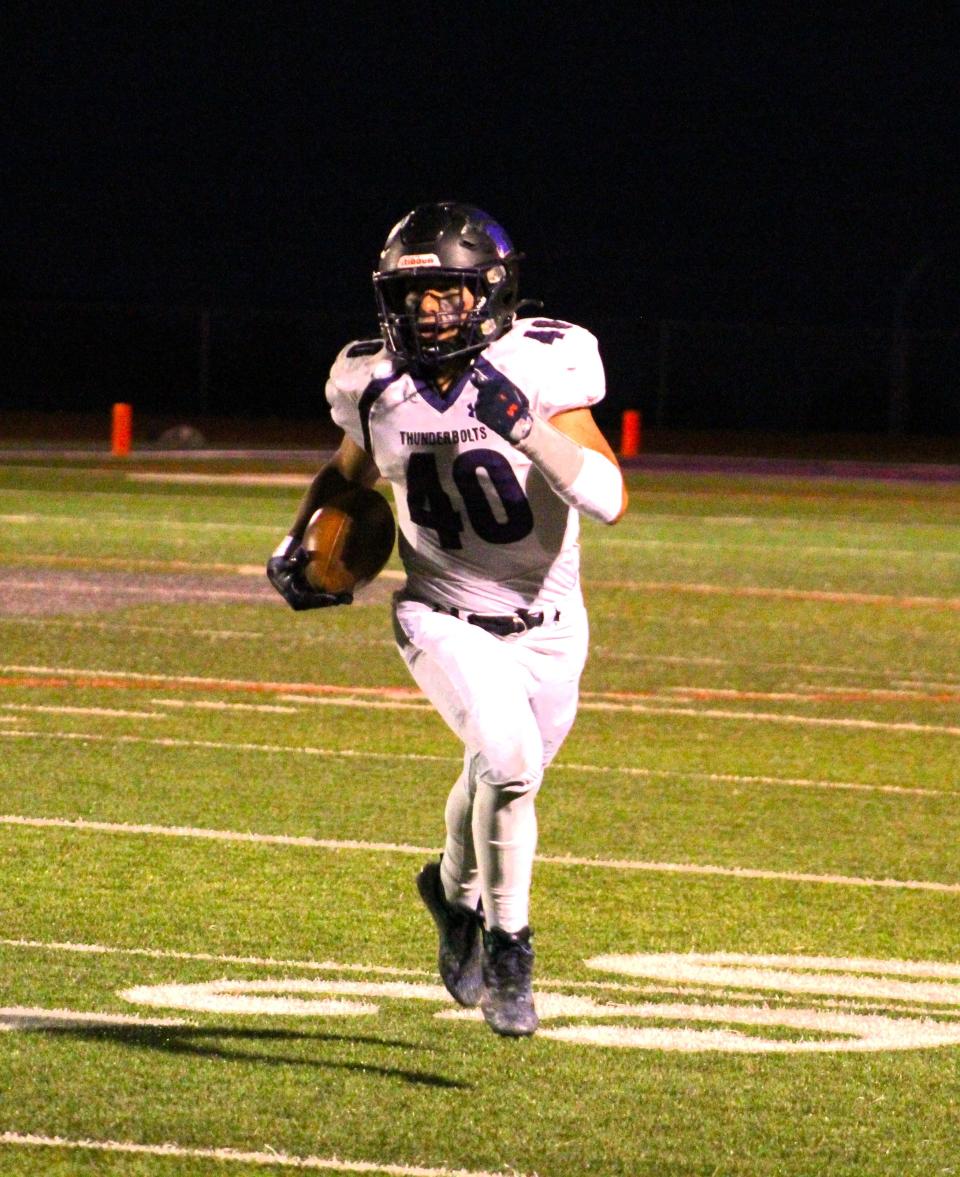 Rye High School running back Derick Bak takes the ball down the sideline in a game against Ellicott at Rye High School on Friday, Sep. 29, 2023.