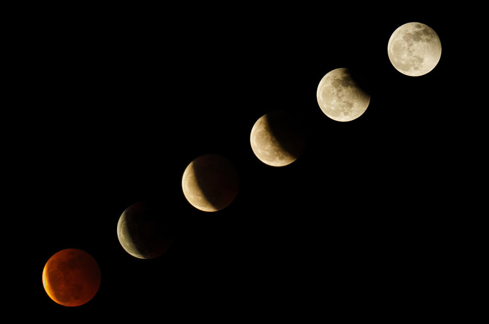 DONGGUAN, CHINA - MAY 26: (EDITOR'S NOTE: COMPOSITE IMAGE) Composite of the moon in various stages of the Super Blood Moon total lunar eclipse on May 26, 2021 in Gongguan, Guangdong Province of China. (Photo by VCG/VCG via Getty Images)