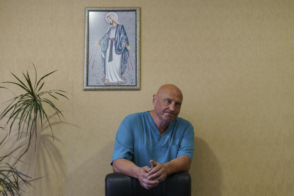 Dr. Ivan Tsyganok, chief physician at the Pokrovsk Perinatal Hospital, stands in his office after delivering a baby Tuesday, Aug. 16, 2022, in Pokrovsk, Donetsk region, eastern Ukraine. As the war reaches the six-month mark, Tsyganok and his colleagues says they have another, more hopeful, reason to stay. “These children we are bringing into the world will be the future of Ukraine,” says Tsyganok. “I think their lives will be different to ours. They will live outside war.” (AP Photo/David Goldman)