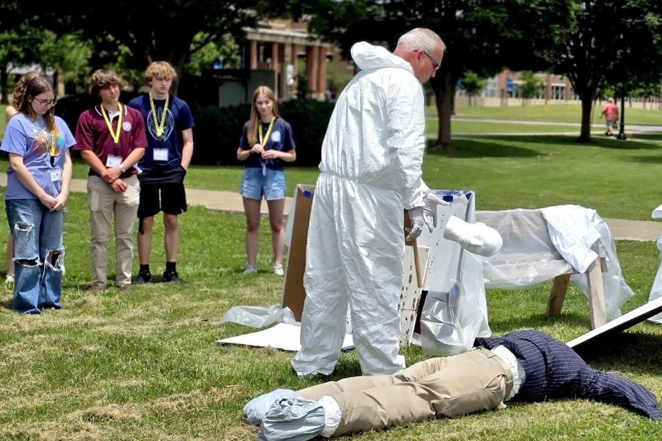 Lt. James Abbott, a detective with the Murfreesboro Police Department and a Middle Tennessee State University adjunct professor in criminal justice, instructs attendees at a mock crime scene at the 2024 CSI: MTSU Forensic Summer Youth Camp for high schoolers held June 11-14 on the MTSU campus in Murfreesboro, Tenn.