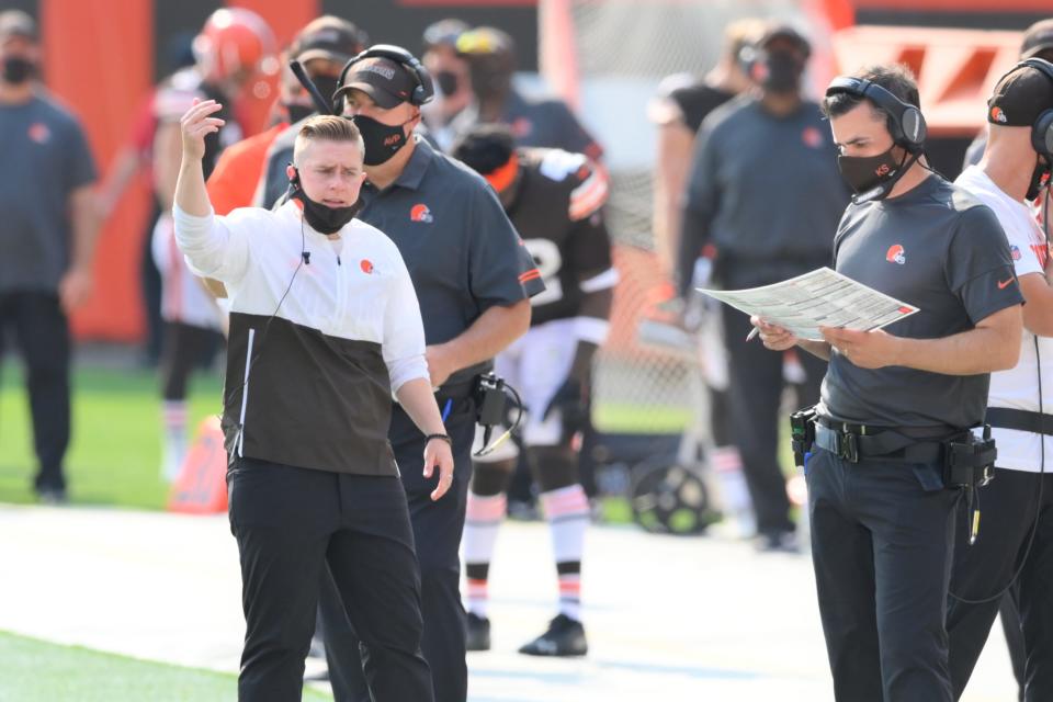 Cleveland Browns chief of staff Callie Brownson, left, reacts on the sideline during a game against the Washington Football Team.