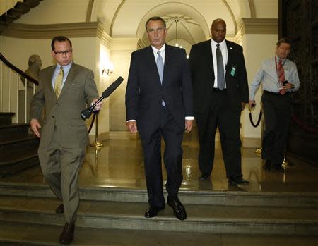 U.S. House Speaker John Boehner (R-OH) (2nd L) departs for a meeting at the White House with President Barack Obama, from the U.S. Capitol in Washington, October 2, 2013. REUTERS/Jonathan Ernst