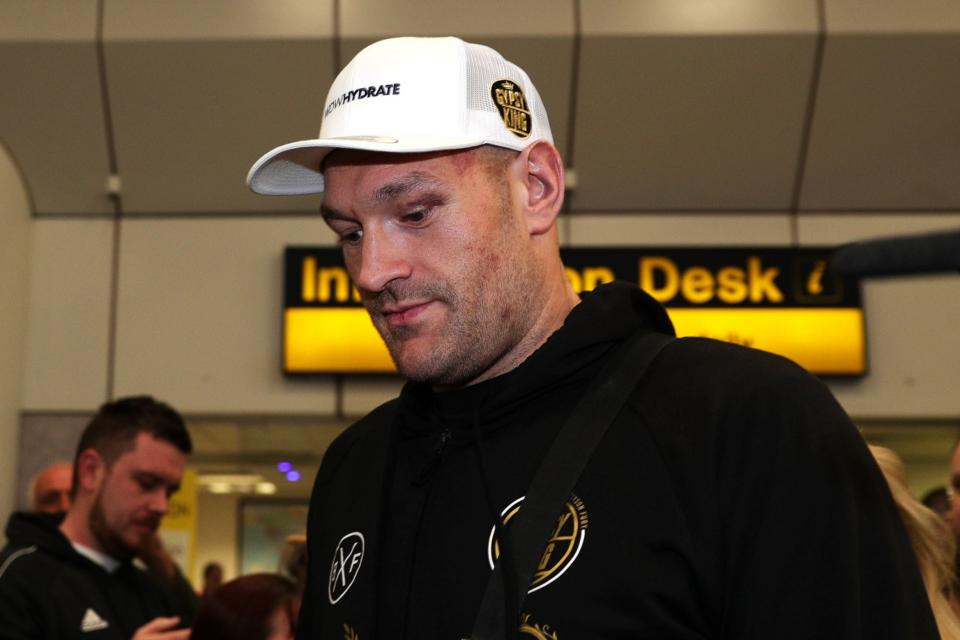 Tyson Fury at Manchester Airport (PA)