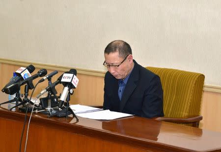 One of the two men whom North Korea identified as being South Korean and accused of being a spy for South Korea attends a news conference in Pyongyang, in this undated photo released by North Korea's Korean Central News Agency (KCNA) in Pyongyang March 26, 2015. REUTERS/KCNA