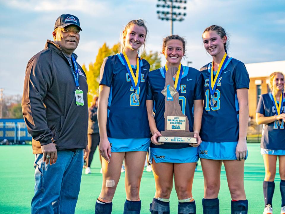 Cape Henlopen 2 Grace Wiggins , 18 Hannah Maney and 20 Devon DeGregory receiving thier state title