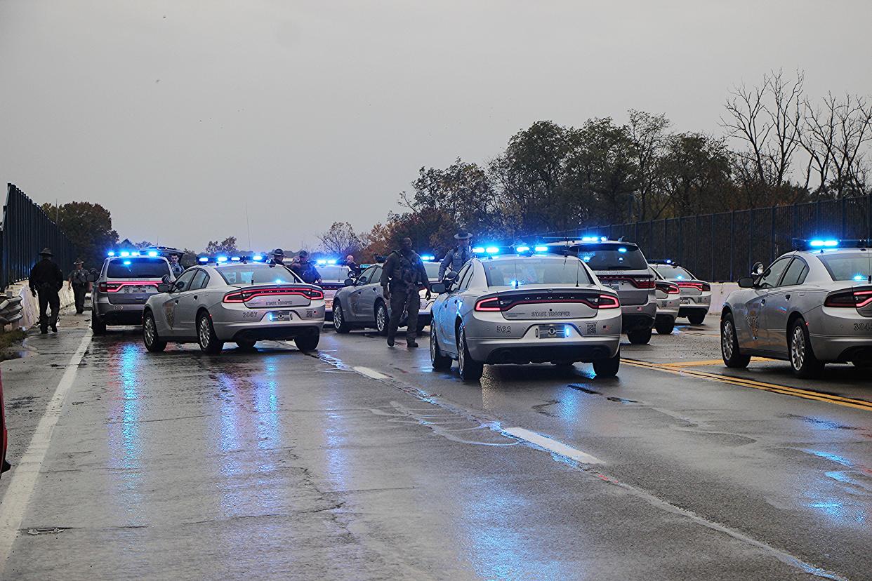 Ohio Highway Patrol and area law enforcement converge on a suspected stolen vehicle after a high-speed pursuit Saturday that ended in Ashland County near US 250.