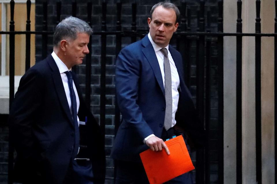 Foreign Secretary Dominic Raab (right) walks from the Foreign Office towards 10 Downing Street (AFP via Getty Images)