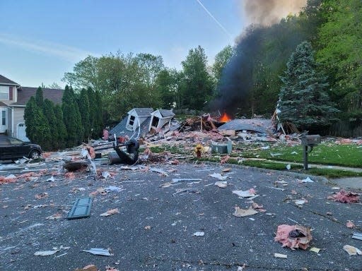 Authorities at the scene of a house explosion on Continental Court in South River Thursday night.