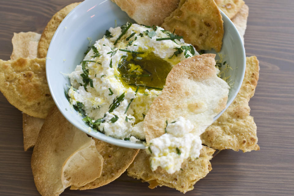 In this image taken on December 3, 2012, buttermilk ricotta cheese dip with homemade crackers is shown in a serving dish in Concord, N.H. (AP Photo/Matthew Mead)