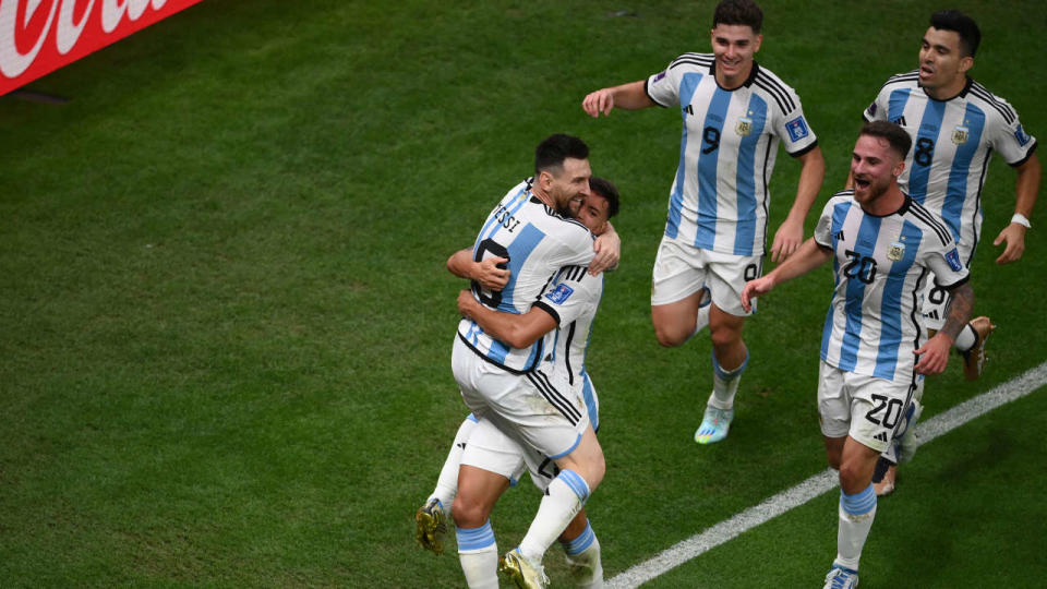 Argentina's defender #26 Nahuel Molina (2ndL) celebrates scoring his team's first goal with Argentina's forward #10 Lionel Messi (L), Argentina's forward #09 Julian Alvarez, Argentina's midfielder #20 Alexis Mac Allister and Argentina's defender #08 Marcos Acuna during the Qatar 2022 World Cup quarter-final football match between The Netherlands and Argentina at Lusail Stadium, north of Doha on December 9, 2022. (Photo by FRANCK FIFE / AFP)