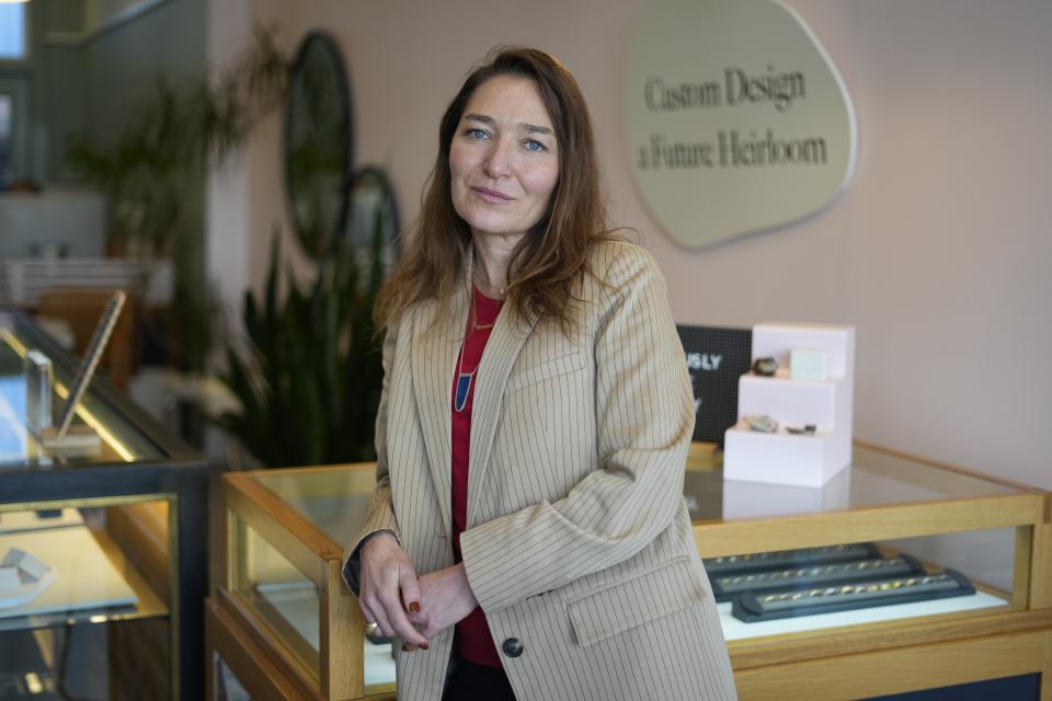 Page Neal, co-founder of Bario Neal, a jewelry store, poses for a photograph at her store in Philadelphia, Wednesday, Feb. 7, 2024. Neal said she co-founded the store to "create jewelry of lasting value that would have a positive impact on people and the planet." (AP Photo/Matt Rourke)