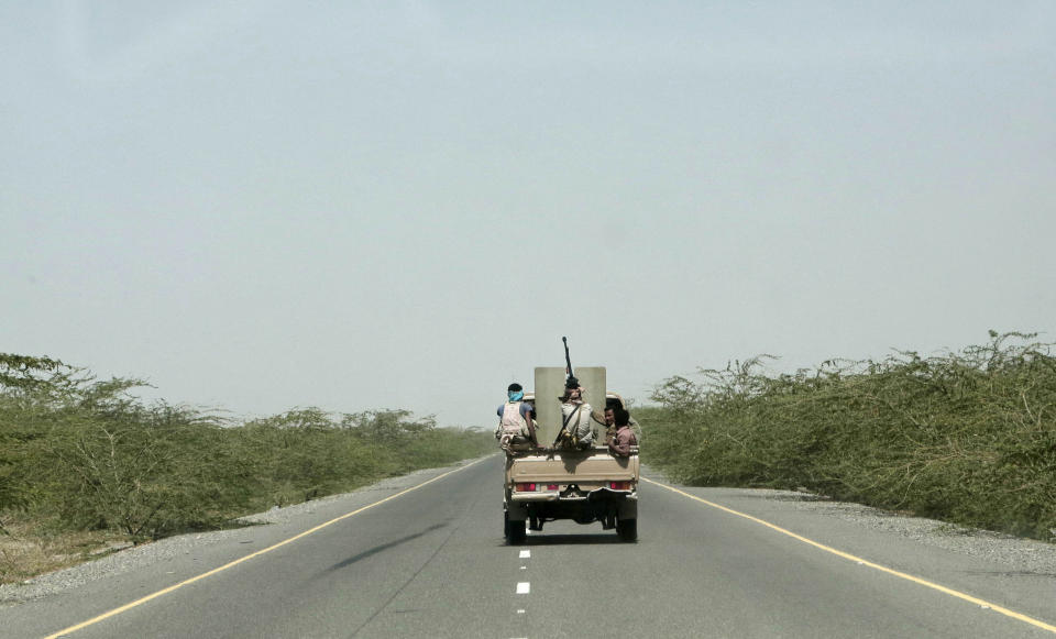 FILE - In this Feb. 12, 2018, file photo, Saudi-backed forces, ride in their vehicle, in Hodeida, Yemen. With US backing, the United Arab Emirates and its Yemeni allies have restarted their all-out assault on Yemen’s port city of Hodeida, aiming to wrest it from rebel hands. Victory here could be a turning point in the 3-year-old civil war, but it could also push the country into outright famine. Already, the fighting has been a catastrophe for civilians on the Red Sea coast. (AP Photo/Nariman El-Mofty, File)