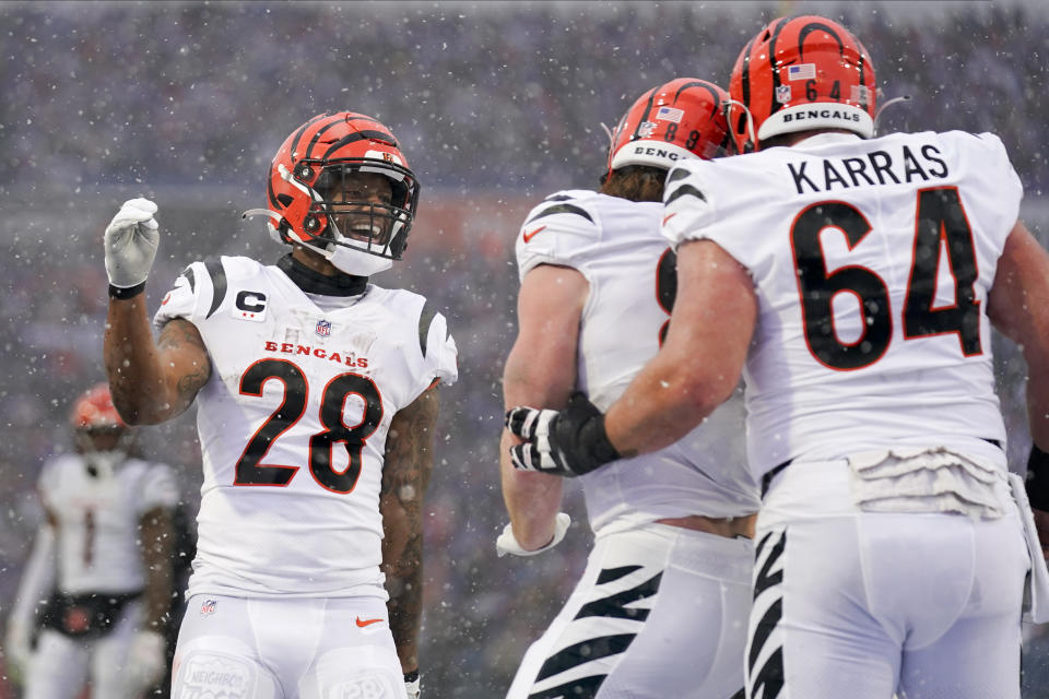 Cincinnati Bengals running back Joe Mixon (28) celebrates with teammates after a touchdown by tight end Hayden Hurst (88) against the Buffalo Bills during the first quarter of an NFL division round football game, Sunday, Jan. 22, 2023, in Orchard Park, N.Y. (AP Photo/Seth Wenig)