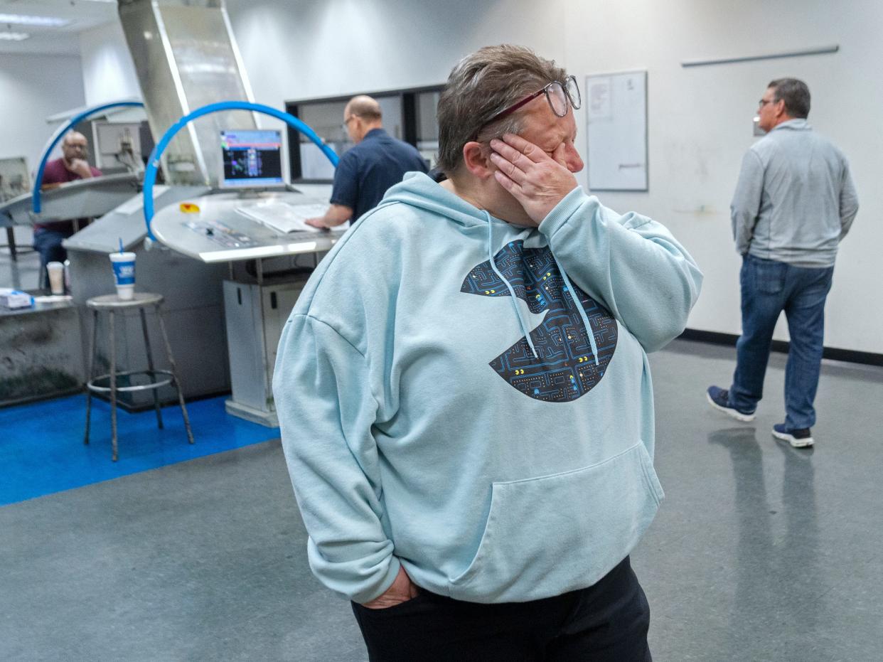 Bridget Baker, associate manager of packaging, wipes a tear on an emotional night Sunday, April 7, 2024 at the Pulliam Production Center. This was the last night for the running of the presses. And it was the last night The Indianapolis Star was printed in Indianapolis.