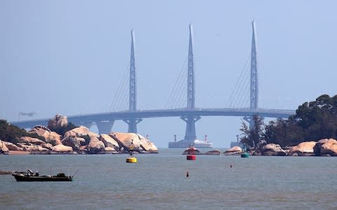 The three bridge towers have been designed to ease the boredom of drivers - Credit: AP