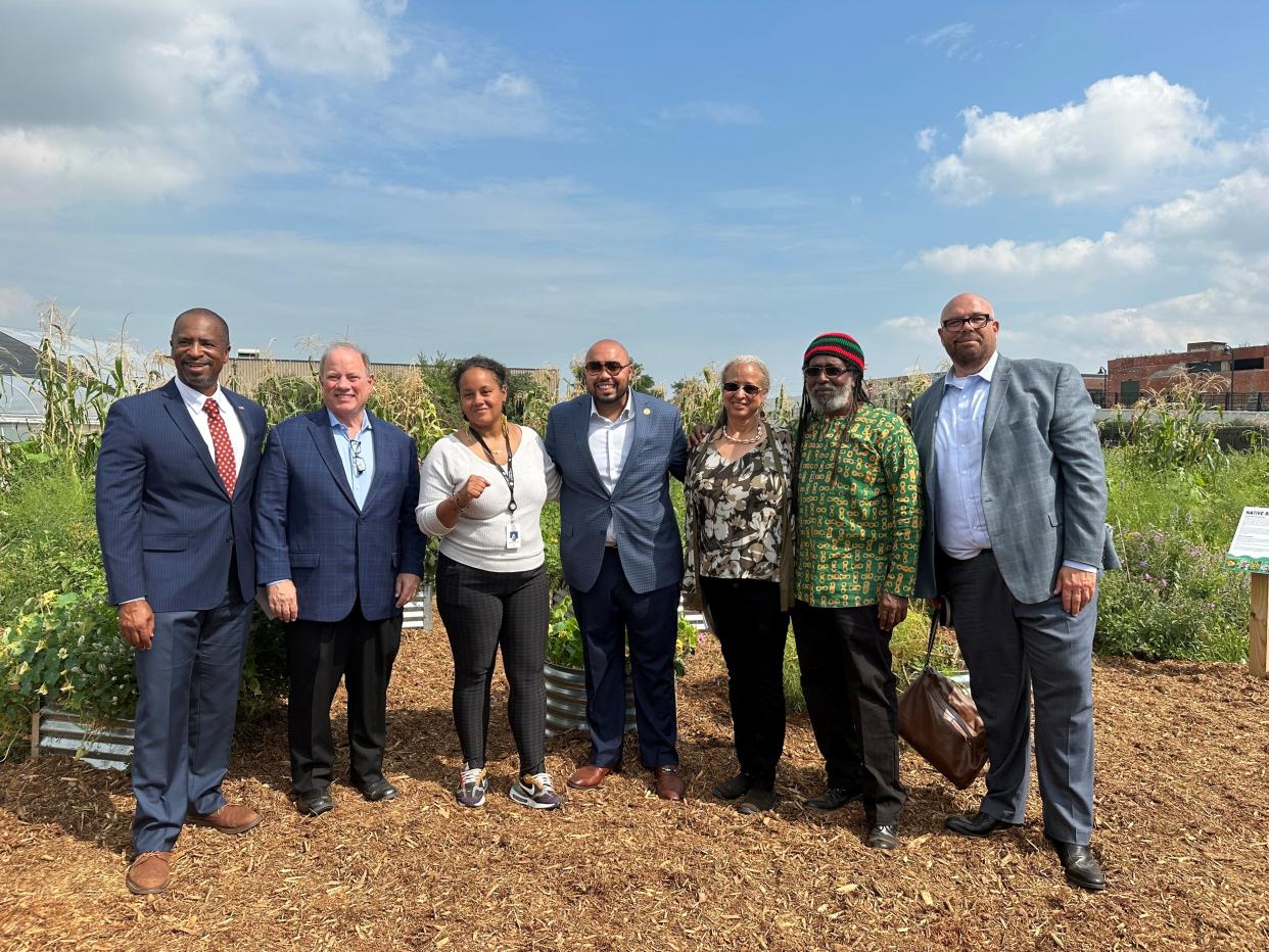 City officials stand alongside Detroit's new Director of Urban Agriculture Tepfirah Rushdan on Monday, Sept. 11 at Keep Growing Detroit.