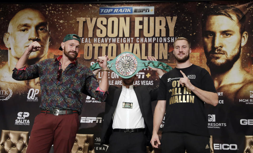 Tyson Fury, left, and Otto Wallin, of Sweden, pose for photos following a news conference Wednesday, Sept. 11, 2019, in Las Vegas. The pair will face each other in a heavyweight boxing match Saturday. (AP Photo/Isaac Brekken)