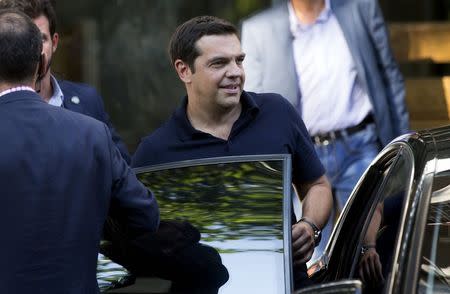 Greek outgoing Prime Minister Alexis Tsipras leaves his party's headquarters in Athens, Greece, August 21, 2015. REUTERS/Stoyan Nenov