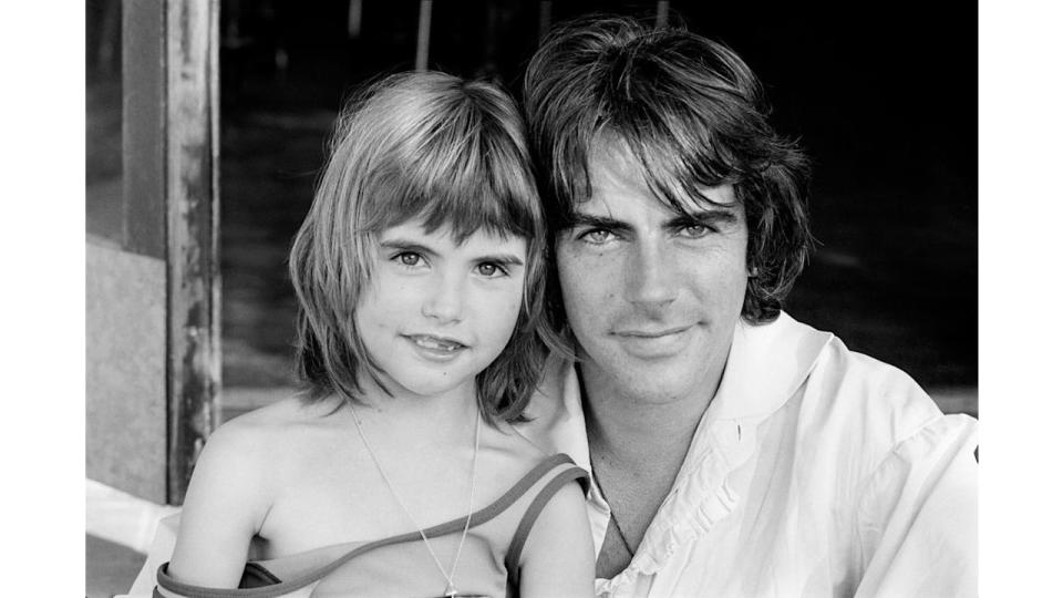 Black-and-white photo of Michael Wilding Jr. with his daughter