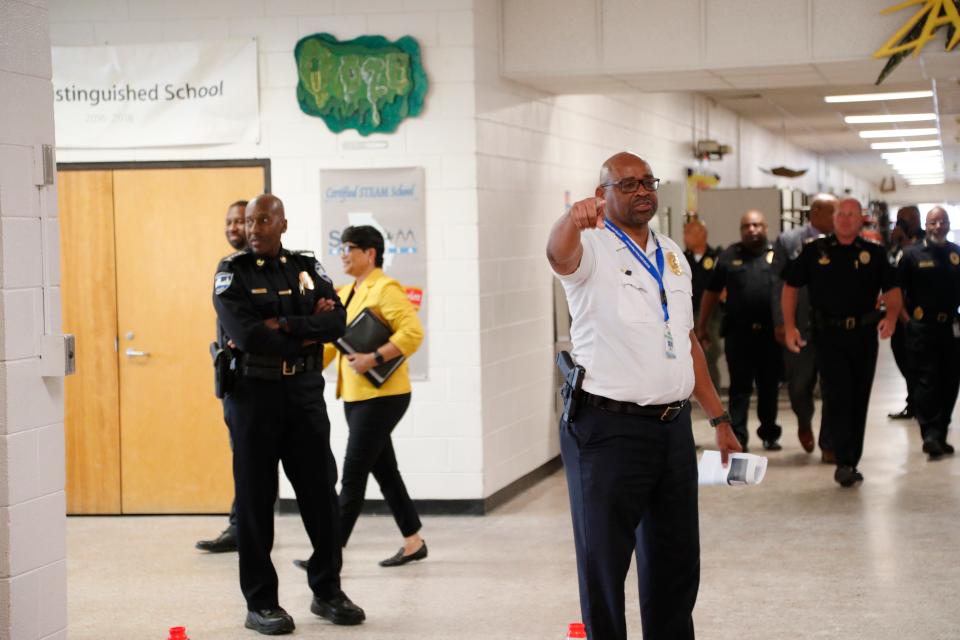 Terry Enoch, Chief of Campus Police for Savannah Chatham County Public Schools, directs participants before the start of an active shooter drill.