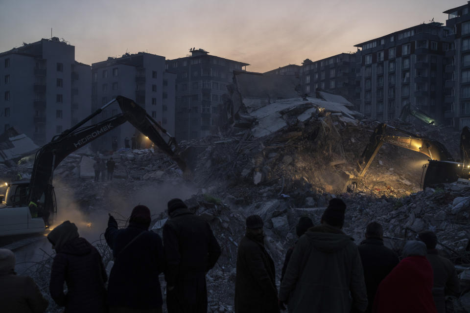 Rescue workers continue the search for victims of the earthquake in Antakya, Turkey, Saturday, Feb. 11, 2023. Rescue crews on Saturday pulled more survivors, including entire families, from toppled buildings despite diminishing hopes as the death toll of the enormous quake that struck a border region of Turkey and Syria five days continued to rise. (AP Photo/Petros Giannakouris)