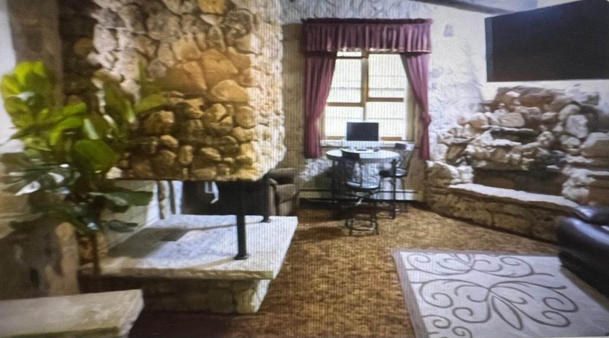 A castle-like home in Hartford, Wis., featured on HGTV's "Ugliest House in America" features stone and concrete walls. The original owner, a medieval enthusiast and mason, wanted the house to resemble a castle fortress.