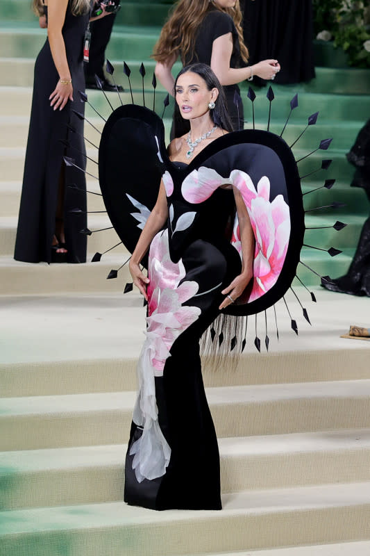 <p>Neilson Barnard/MG24/Getty Images</p><p>The actress wowed on the red carpet in this floral number with giant shoulder pieces that framed the gown. </p>