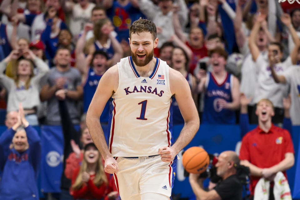Kansas center Hunter Dickinson celebrates after his basket that gave his team a win over TCU during the second half of an NCAA college basketball game in Lawrence, Kan., Saturday, Jan. 6, 2024. (AP Photo/Reed Hoffmann)