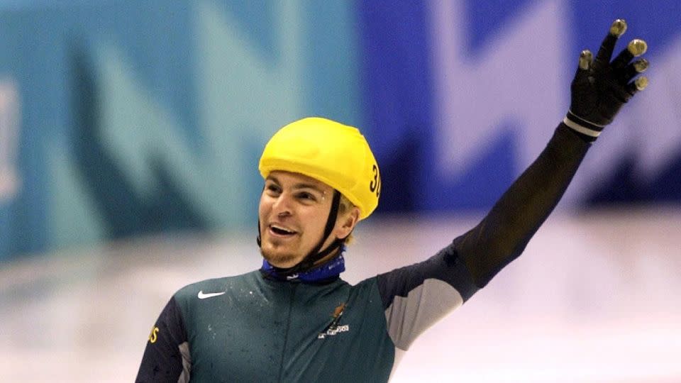 Australian Steven Bradbury waves to the crowd after winning gold in the men's 1,000-meter short-track speed skating finals at the 2002 Winter Olympics. - Tim de Waele/Getty Images