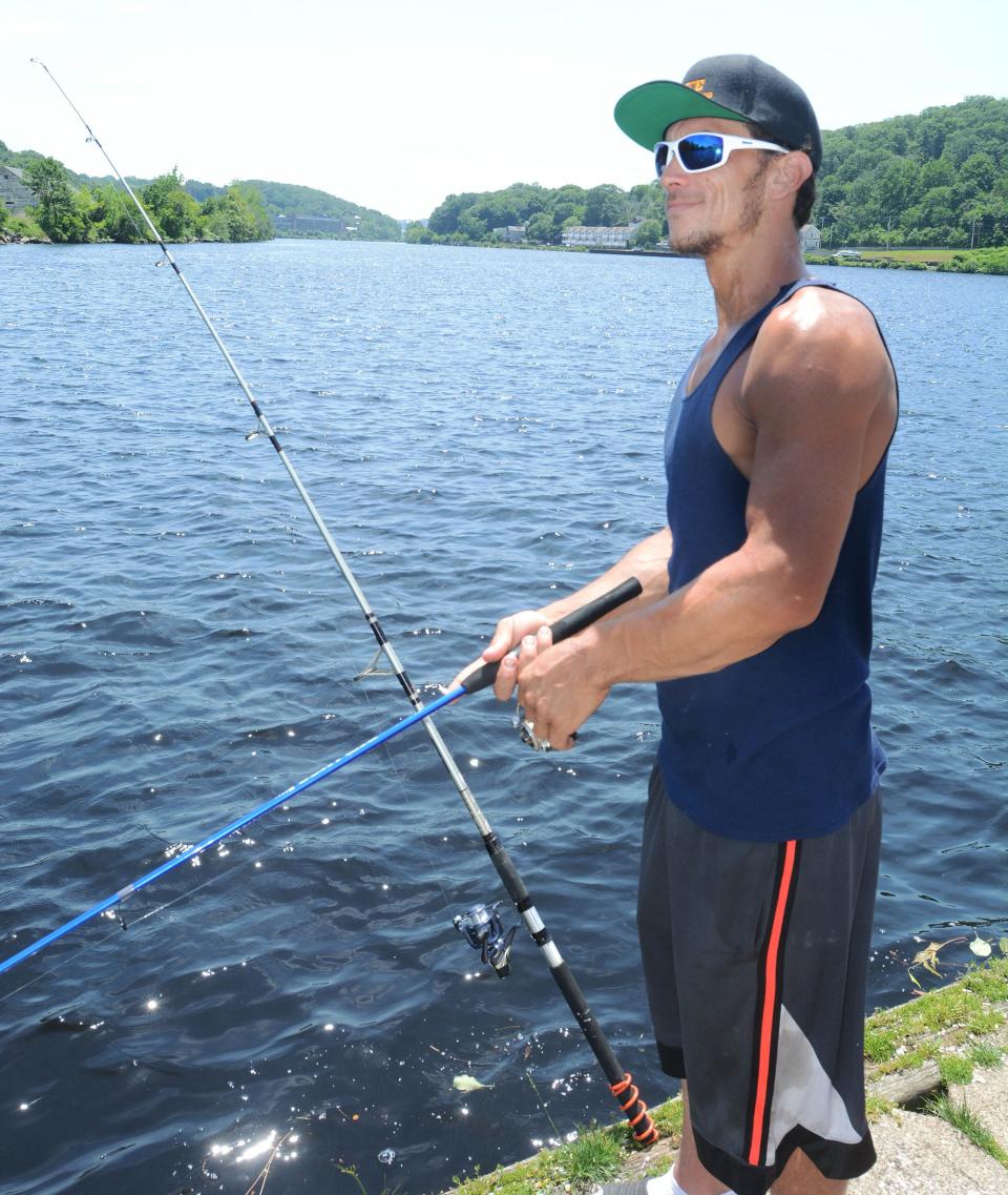 Randy St. Jean, 32, of Lisbon, fishes at Howard T. Brown Memorial Park.